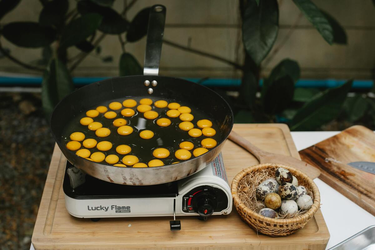 Frying quail eggs on a pan