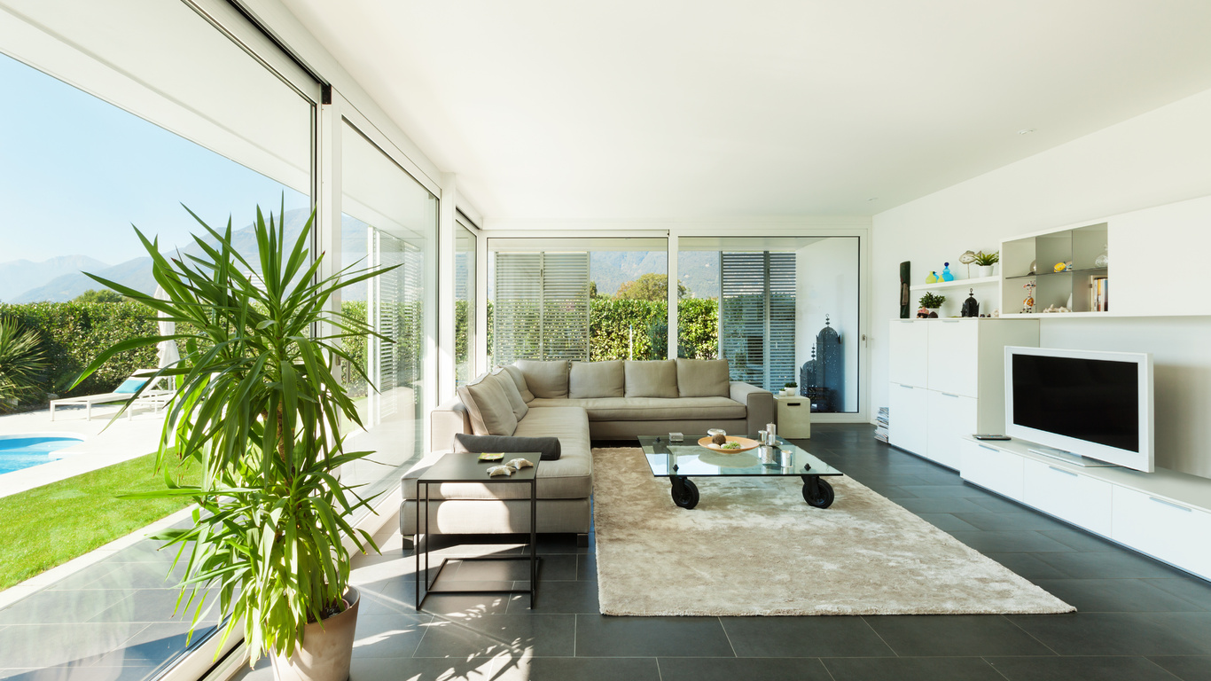 Collage of images showcasing top home remodeling trends in Austin for 2025, including retro aesthetics, open-concept living, sustainable design, and smart home technology.