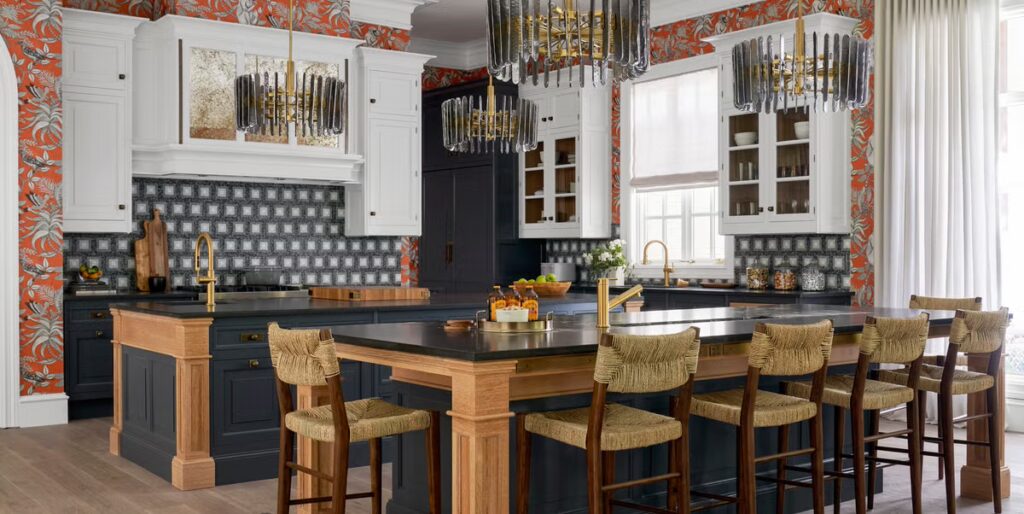 Modern kitchen with a large island, quartz countertops, stylish cabinets, and elegant lighting showcasing 2025 remodeling trends