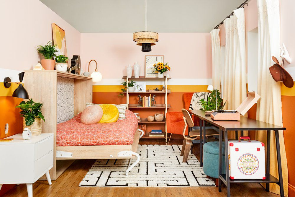 A modern small apartment with a Murphy bed, floating shelves, and a multifunctional dining area, designed for space efficiency and style.