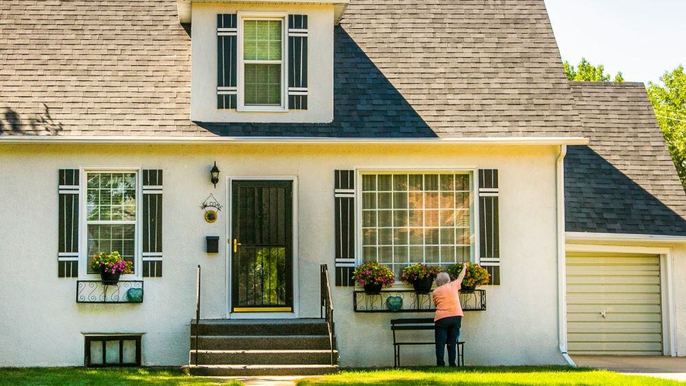 Beautiful Texas home with enhanced curb appeal, modern landscaping, and a freshly painted door—showcasing value-boosting home improvement hacks.