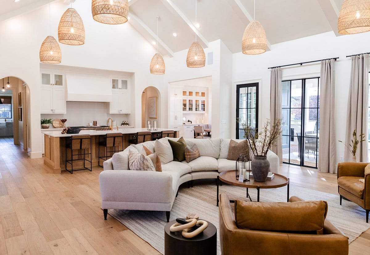Modern open-concept living area with remodeled kitchen and dining space, showcasing expert craftsmanship by Together Design & Build.